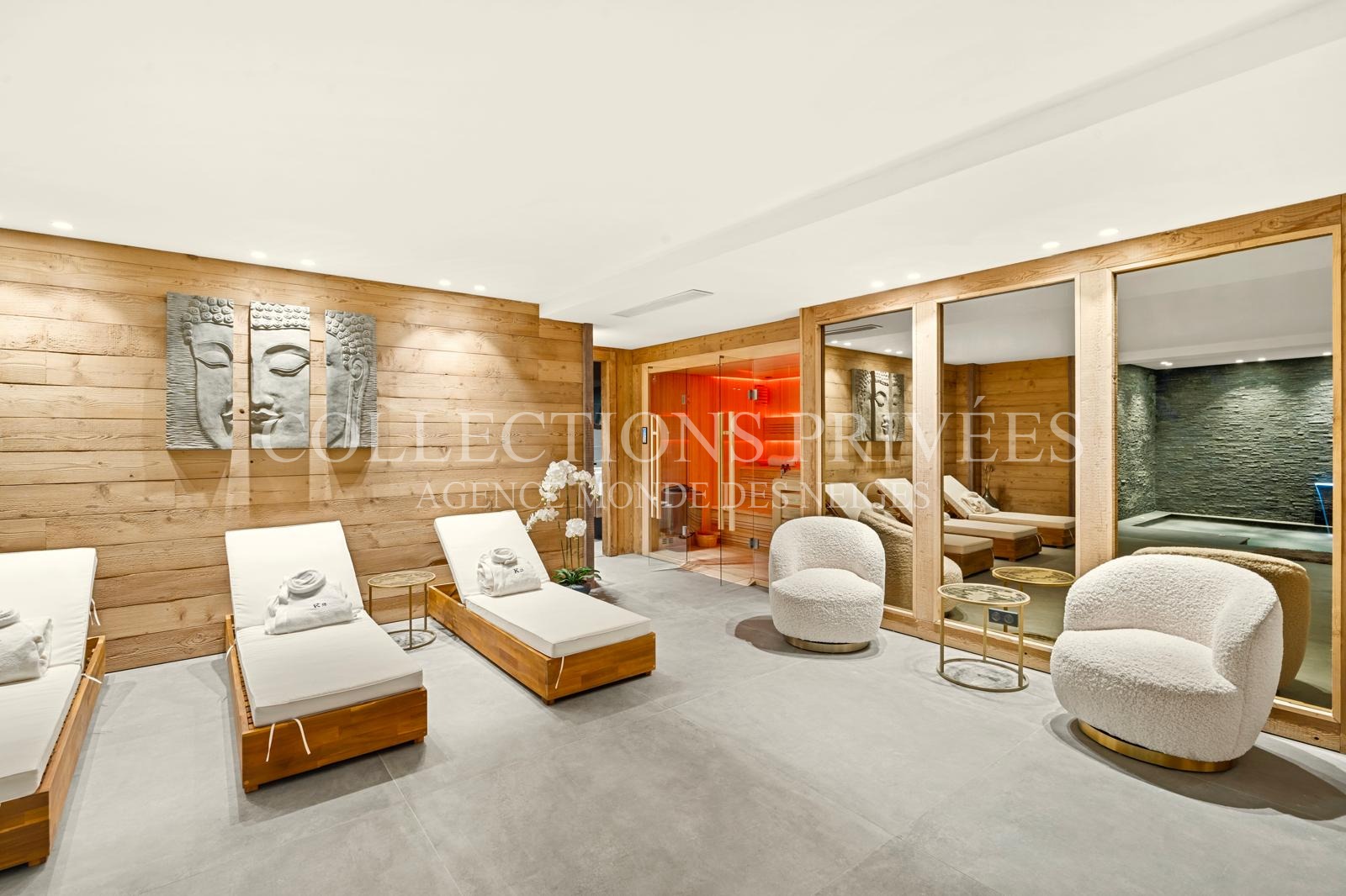 Piscine intérieure privée chalet luxe Auron mur pierre naturelle