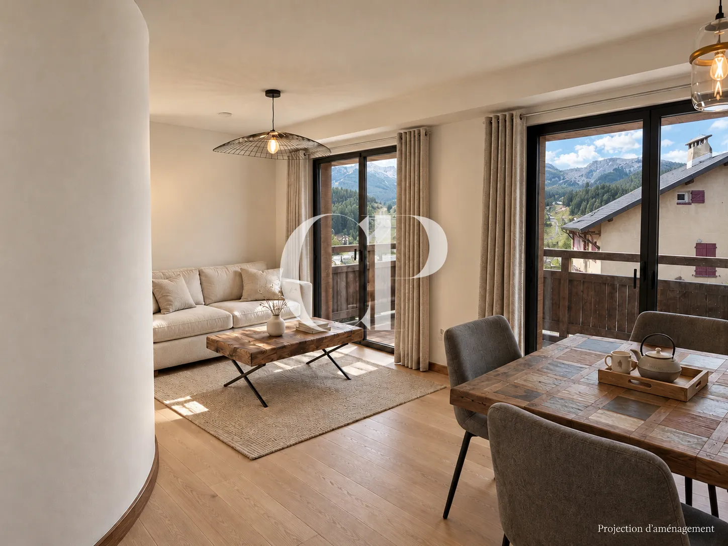 The living room, opening onto the terrace and the mountains